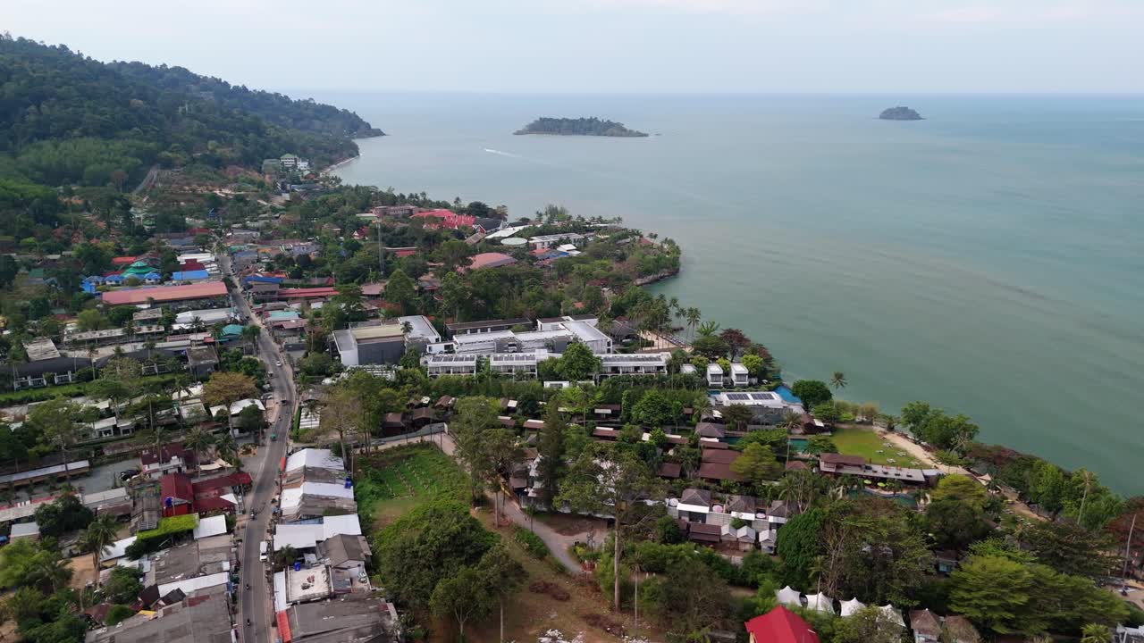 drone footage of Kai Bae village on Koh Chang island with hotel accommodation and the ocean
