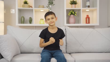 boy experiencing joy looking at camera.