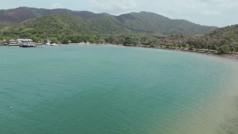 the chaguaramas boardwalk and williams bay are seen from a drone's eye view on trinidad, nestled in the caribbean.