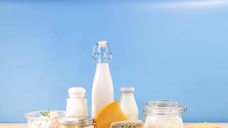 assorted dairy items displayed against blue backdrop