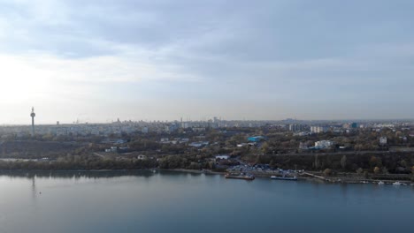 aerial view on danube river and galati city in romania during sunset - drone shot