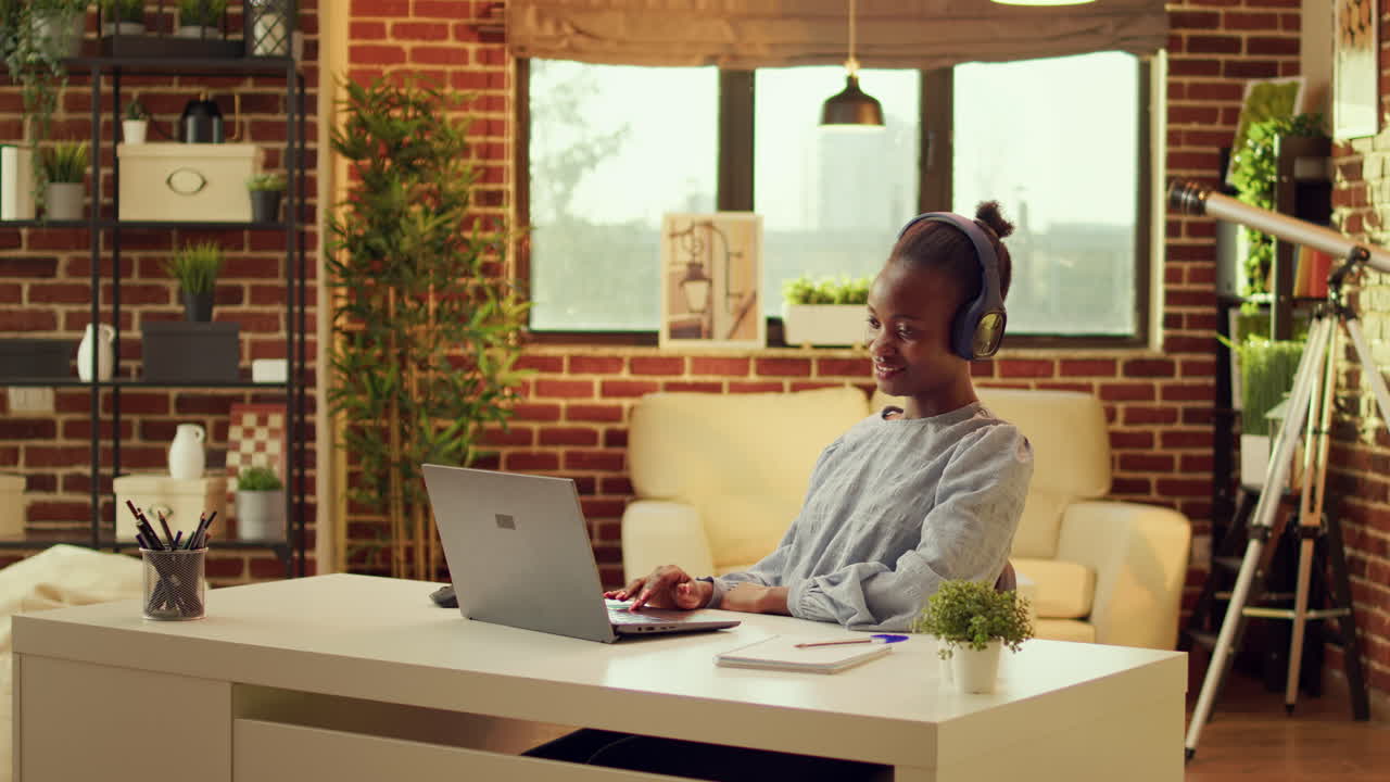 Happy worker listens to music