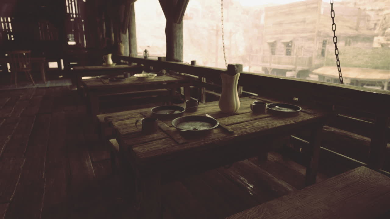 Rustic dining area in an ancient building overlooking a scenic landscape