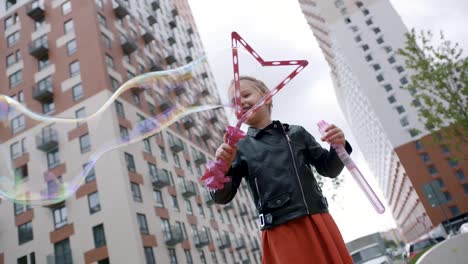 girl playing with bubbles in city