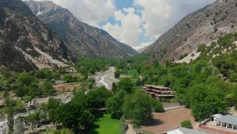 aerial view of valley surrounded by hindu kush mountain range