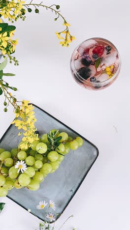 summer cocktail and grapes