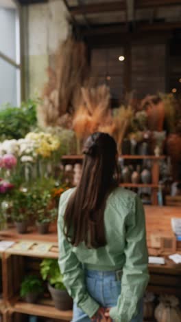 woman browsing a flower shop