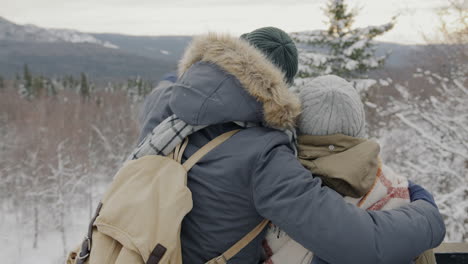 Couple enjoying a winter hike in the mountains