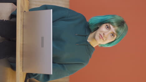 Vertical-video-of-Young-woman-giving-greeting-and-applause-to-camera.