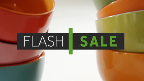 flash verkoop tekst animatie over kleurrijke gestapelde schalen