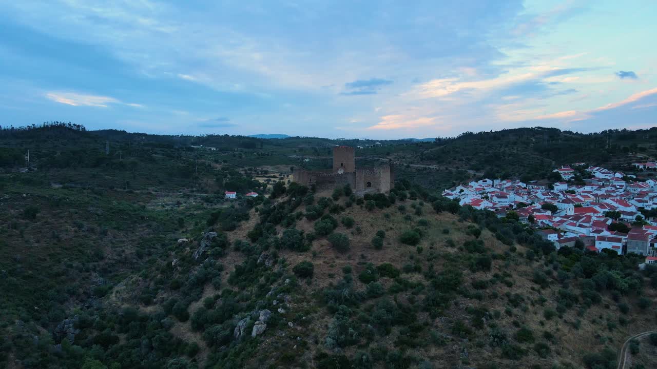 Aerial view of an old castle on the top of a mountain in Belver, Portugal