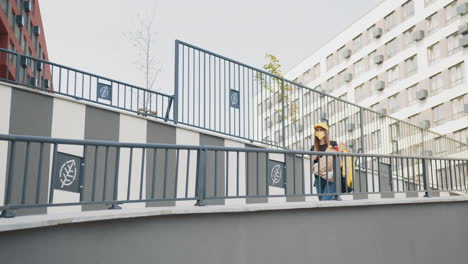 woman carrying groceries in a city environment