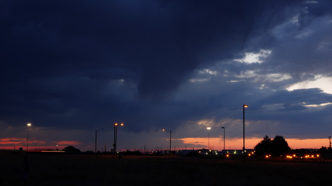 Storm clouds form at sunset in time-lapse motion.