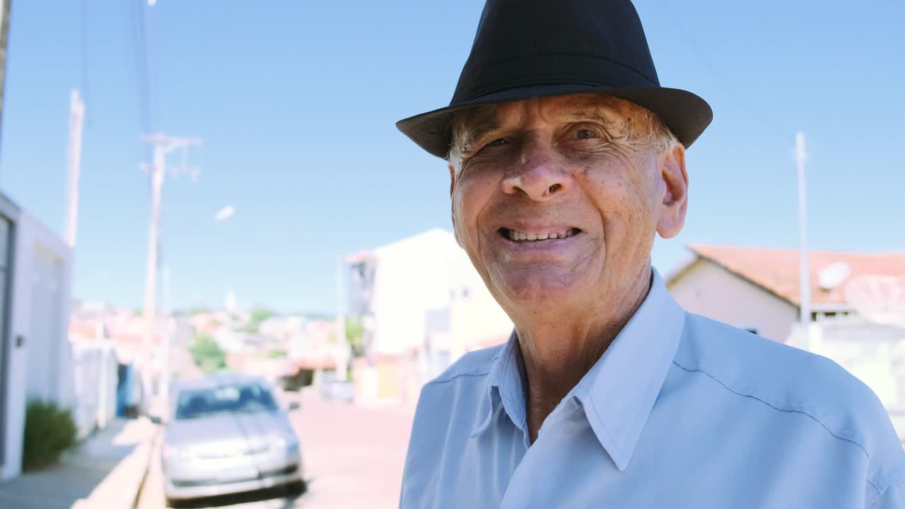 Portrait of an elderly man wearing a hat