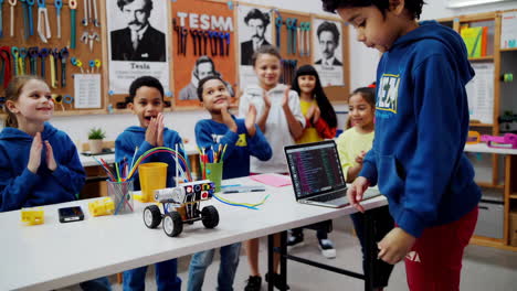 children engaged in a robotics and coding stem project