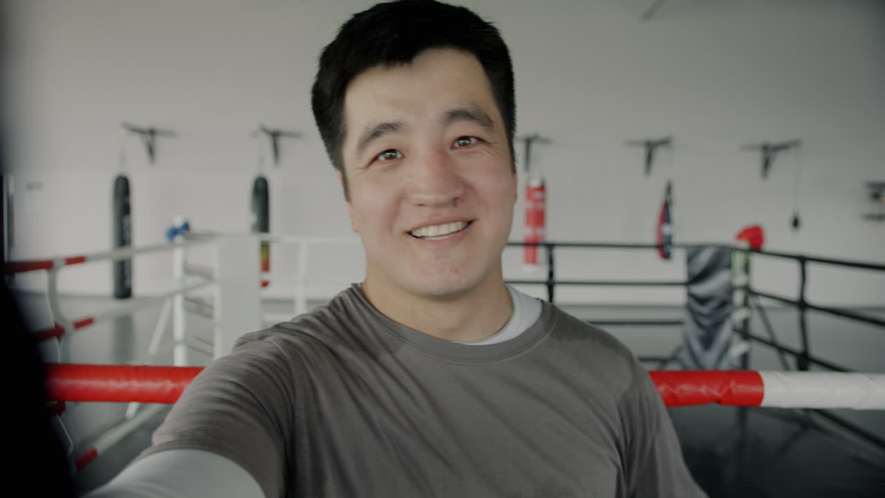 Man taking selfie in boxing ring