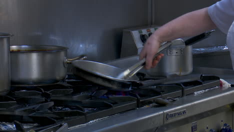 chef cooking on a stove