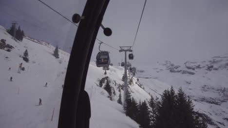 pov shot of gondola trip up the swiss alps