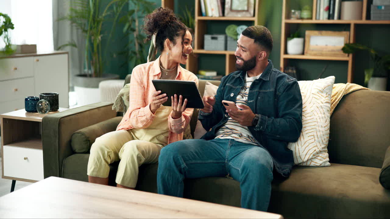 Couple using a tablet together at home