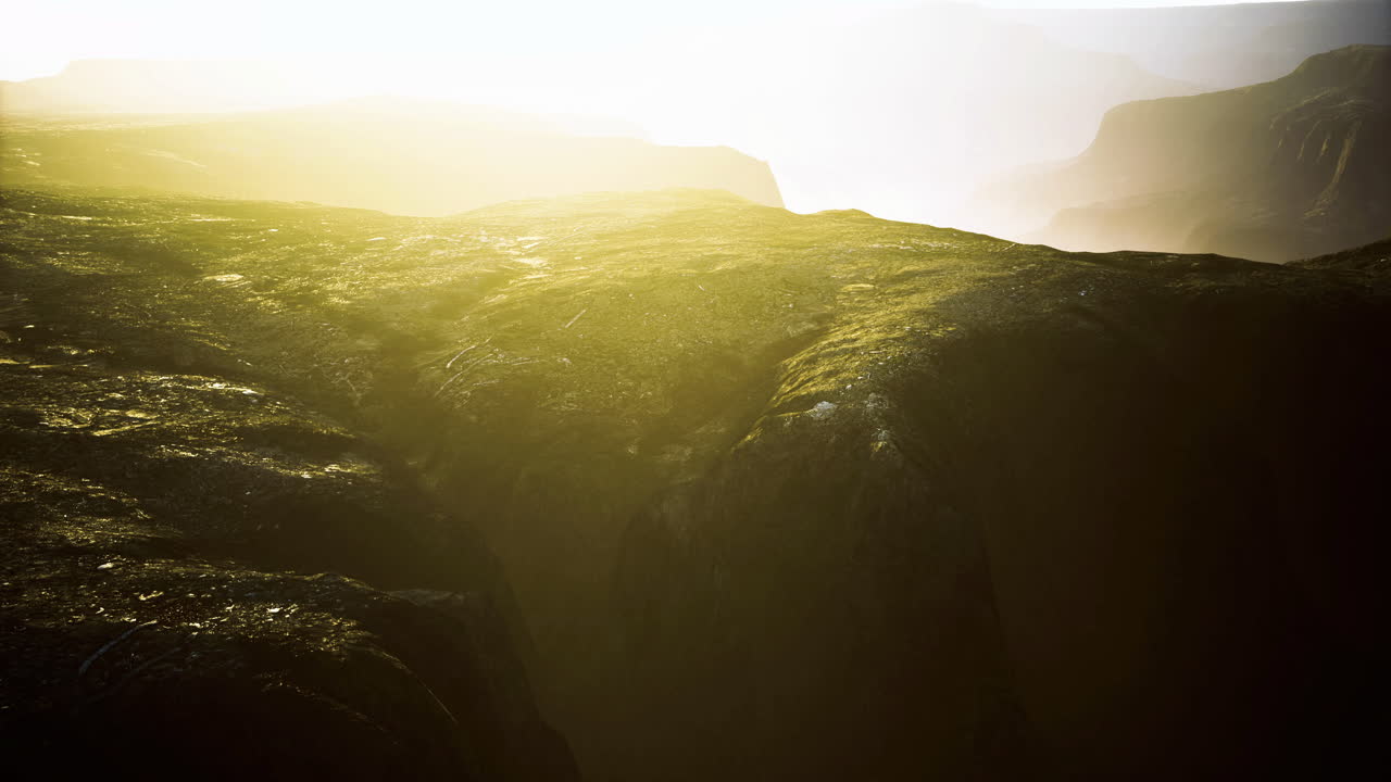 Spectacular canyon view with sunlight breaking through at dawn in nature