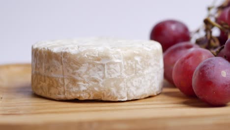 camembert cheese and grape on table