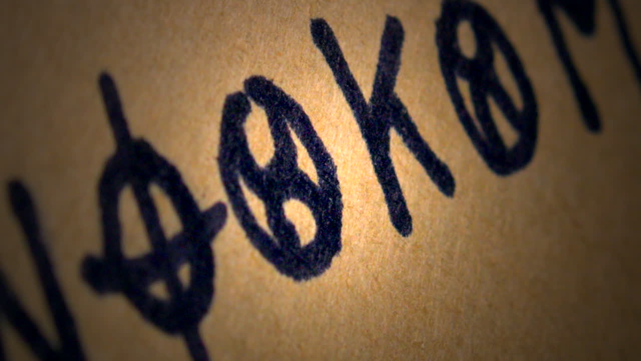 Slide shot reveals Aged Parchment paper mystery cryptic cipher code CLOSE-UP