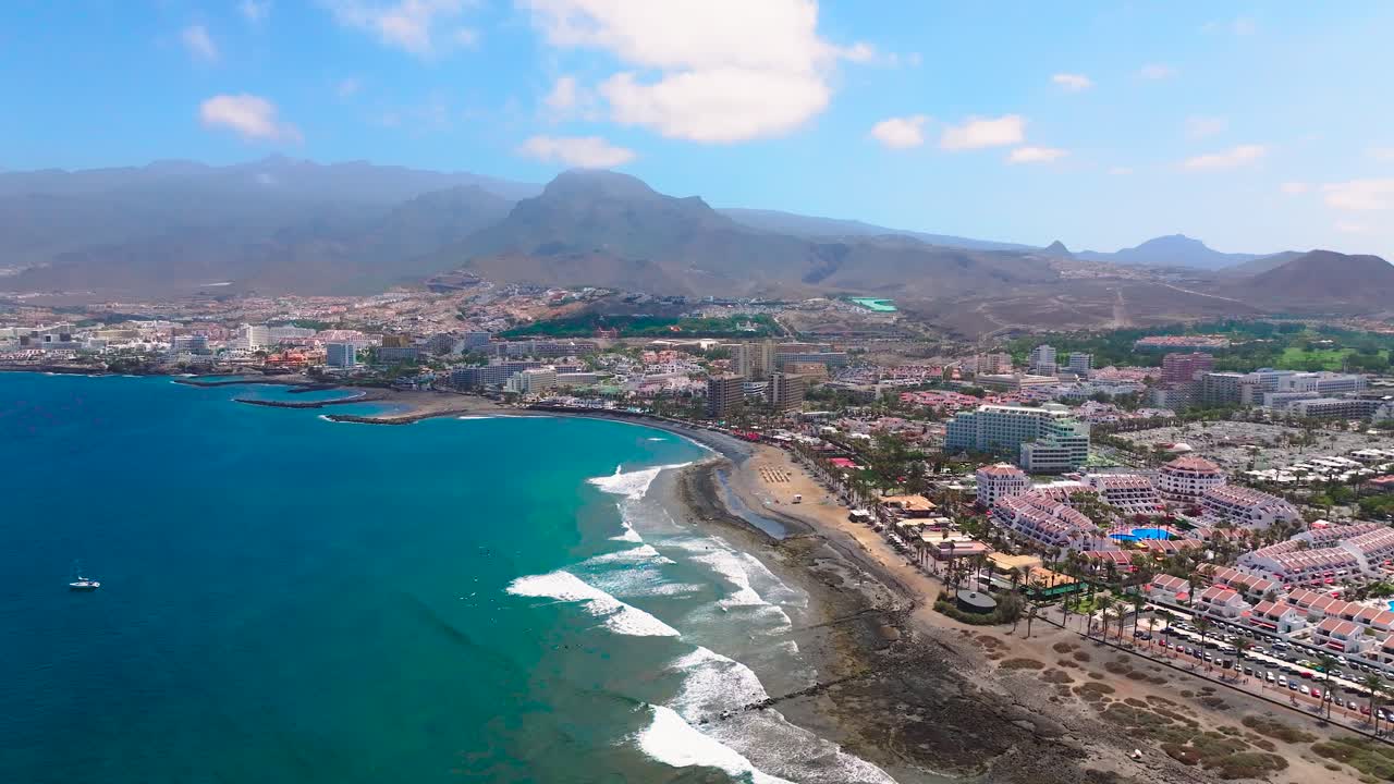 Troya beach, blue ocean and mountains in the canary islands, aerial view