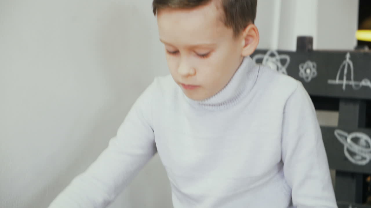 Boy playing with puzzle. Early education concept