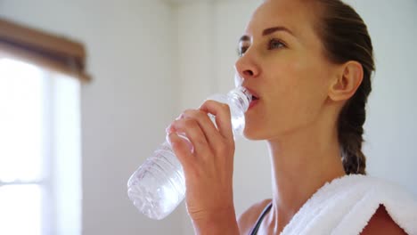 woman drinking water in the gym 4k