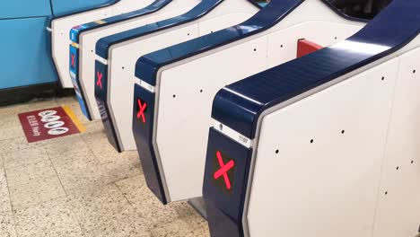passengers going through ticket gate in kowloon tong mtr station, hong kong. 12 march 2019