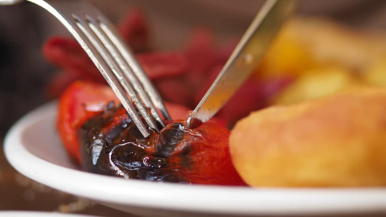 Eating a meal with fork and knife