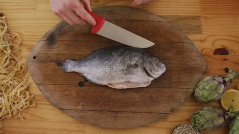 chef cutting a fish