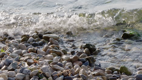 crashing waves at a stony lakeshore