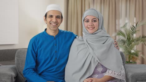 happy muslim couple smiling to the camera