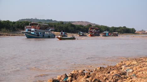 Medium-Exterior-Shot-of-Boats-in-River-at-Floating-Village