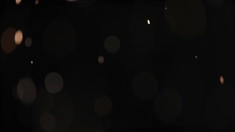 bokeh de partículas abstractas flotantes sobre fondo oscuro