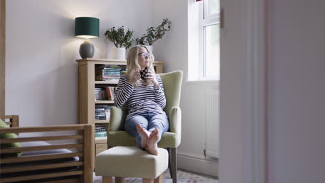 woman relaxing in a chair at home