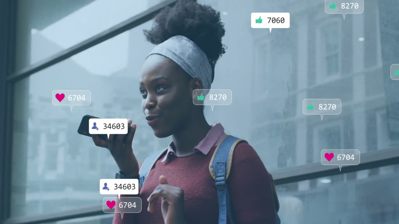 Animation of icons and data processing over african american woman using smartphone
