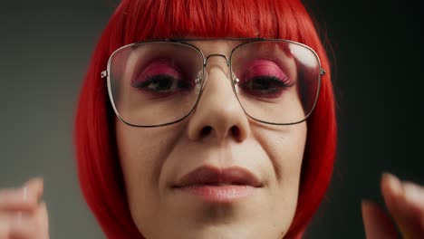 woman with red wig and glasses