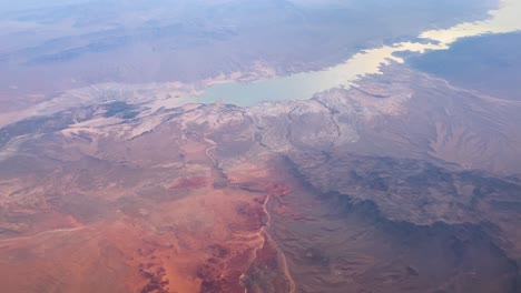 aerial view of lake in red rock mountains