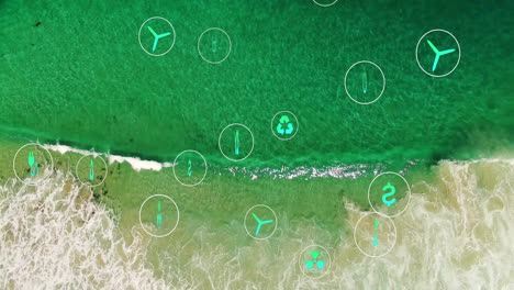 animation of environmental icons overlaying ocean waves meeting sandy shore