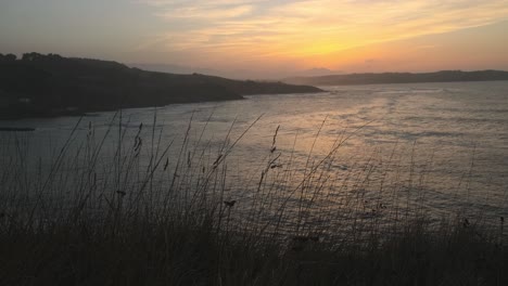 static shot of peaceful seascape at sunset time