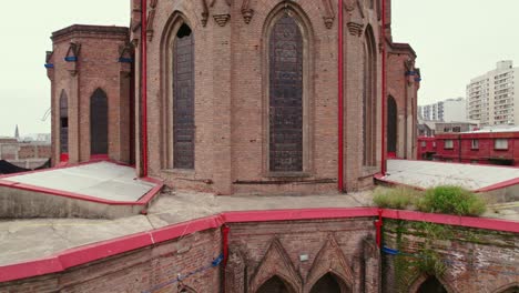 close-up view of earthquake-damaged neo-gothic brick architecture reinforced by metal supports, ambo area of the salvador basilica, santiago, chile