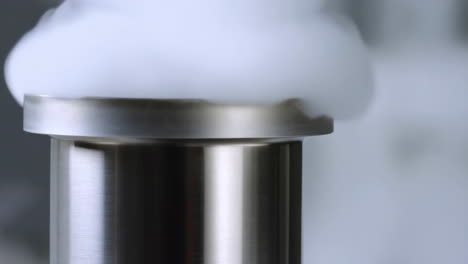 Thick White Vapor Billows from a Metal Container