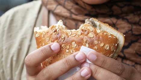 person eating a sandwich