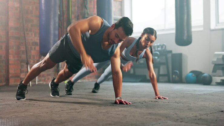 Health, fitness and exercise with couple in gym