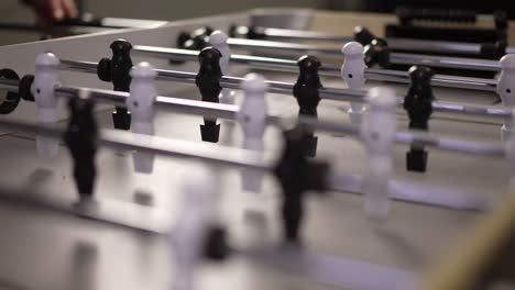 people playing foosball in slow motion