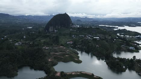 piedra del penol top notch aerial drone zoom out guatape magnificent stone town flying in medellin colombia village