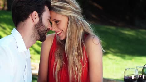 smiling romantic couple looking face to face