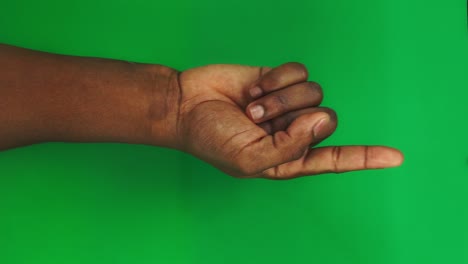 15 gestures package for controlling the touch screen with a male black hand on a green screen